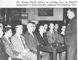 A photo of George Crouch teaching a class. 