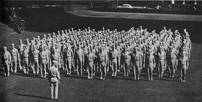 A photo of students soldiers on the lawn. 