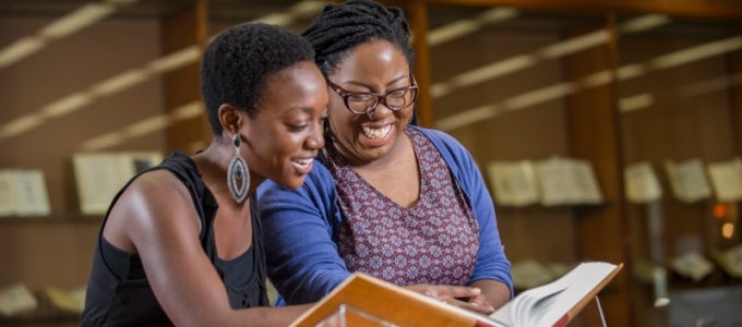 Students reviewing a book